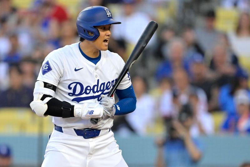 Jun 21, 2024; Los Angeles, California, USA;  Los Angeles Dodgers designated hitter Shohei Ohtani (17) reacts after a foul ball in the first inning against the Los Angeles Angels at Dodger Stadium. Mandatory Credit: Jayne Kamin-Oncea-USA TODAY Sports