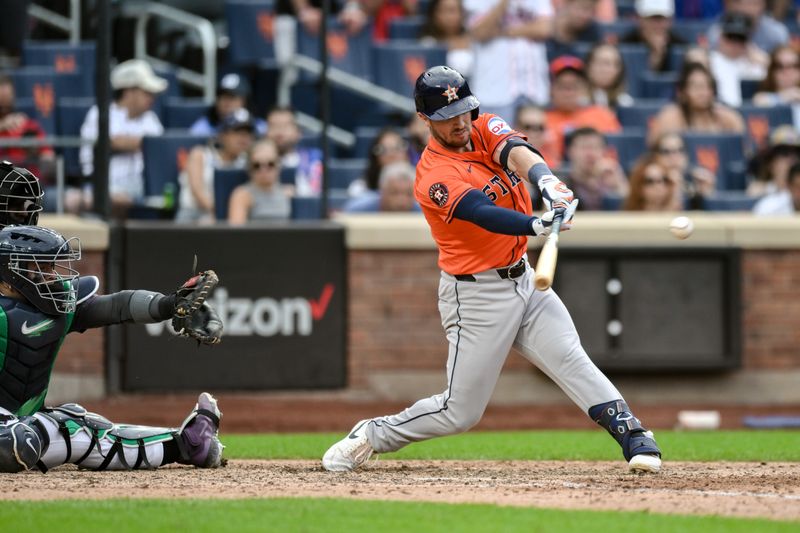 Jun 29, 2024; New York City, New York, USA; Houston Astros third baseman Alex Bregman (2) hits a two RBI single against the New York Mets during the eighth inning at Citi Field. Mandatory Credit: John Jones-USA TODAY Sports