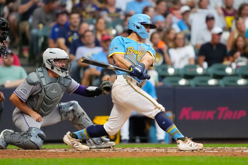 Jun 27, 2025; Milwaukee, Wisconsin, USA;  Milwaukee Brewers right fielder Sal Frelick (10) drives in a run during the fourth inning against the Colorado Rockies at American Family Field. Mandatory Credit: Jeff Hanisch-Imagn Images