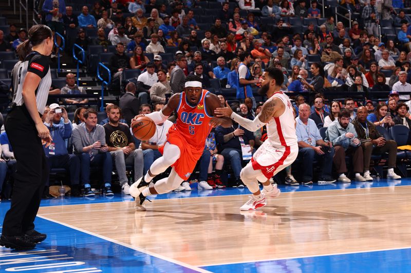 OKLAHOMA CITY, OK - FEBRUARY 27: Luguentz Dort #5 of the Oklahoma City Thunder dribbles the ball during the game against the Houston Rockets on February, 2024 at Paycom Arena in Oklahoma City, Oklahoma. NOTE TO USER: User expressly acknowledges and agrees that, by downloading and or using this photograph, User is consenting to the terms and conditions of the Getty Images License Agreement. Mandatory Copyright Notice: Copyright 2024 NBAE (Photo by Zach Beeker/NBAE via Getty Images)