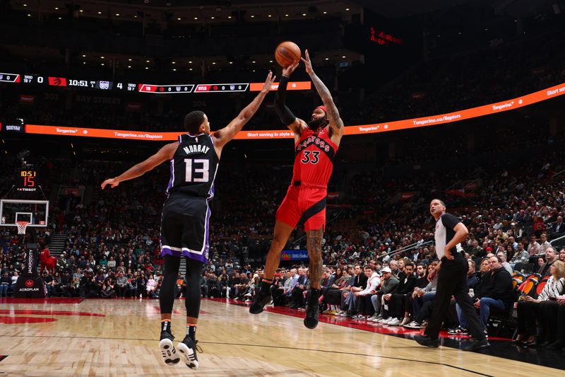 TORONTO, CANADA - MARCH 20: Gary Trent Jr. #33 of the Toronto Raptors shoots the ball during the game against the Sacramento Kings on March 20, 2024 at the Scotiabank Arena in Toronto, Ontario, Canada.  NOTE TO USER: User expressly acknowledges and agrees that, by downloading and or using this Photograph, user is consenting to the terms and conditions of the Getty Images License Agreement.  Mandatory Copyright Notice: Copyright 2024 NBAE (Photo by Vaughn Ridley/NBAE via Getty Images)