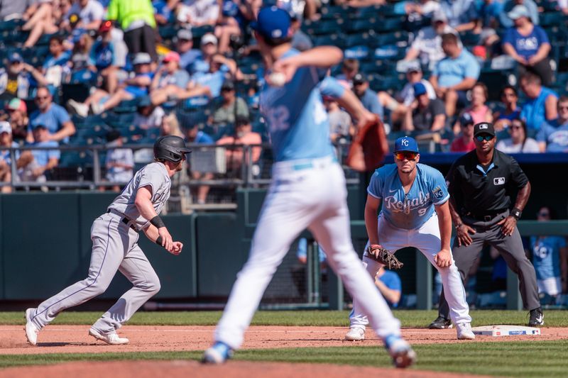 Jun 3, 2023; Kansas City, Missouri, USA; Kansas City Royals starting pitcher Daniel Lynch (52) throws to first base during the fifth inning against the Colorado Rockies at Kauffman Stadium. Mandatory Credit: William Purnell-USA TODAY Sports