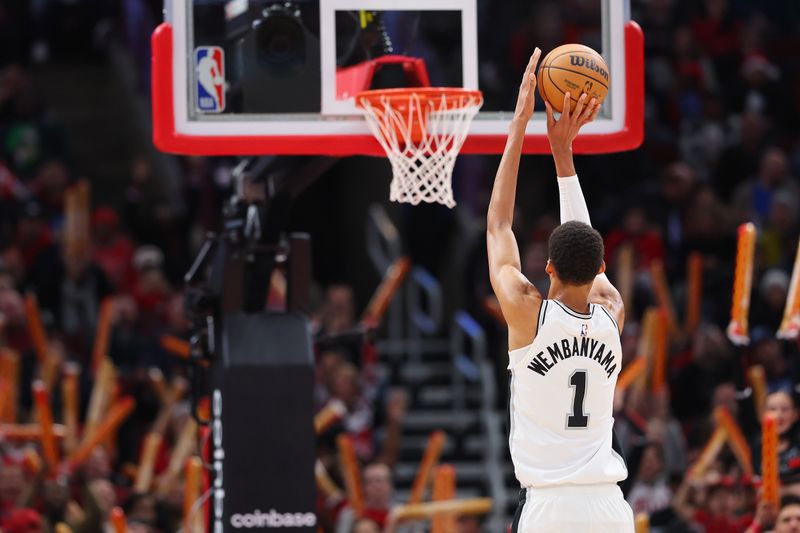 CHICAGO, ILLINOIS - DECEMBER 21: Victor Wembanyama #1 of the San Antonio Spurs shoots a free throw against the Chicago Bulls during the second half at the United Center on December 21, 2023 in Chicago, Illinois. NOTE TO USER: User expressly acknowledges and agrees that, by downloading and or using this photograph, User is consenting to the terms and conditions of the Getty Images License Agreement.  (Photo by Michael Reaves/Getty Images)