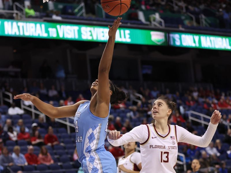 Mar 7, 2025; Greensboro, NC, USA;  North Carolina Tar Heels guard Indya Nivar (24) goes for the basket during the first quarter at First Horizon Coliseum. Mandatory Credit: Cory Knowlton-Imagn Images