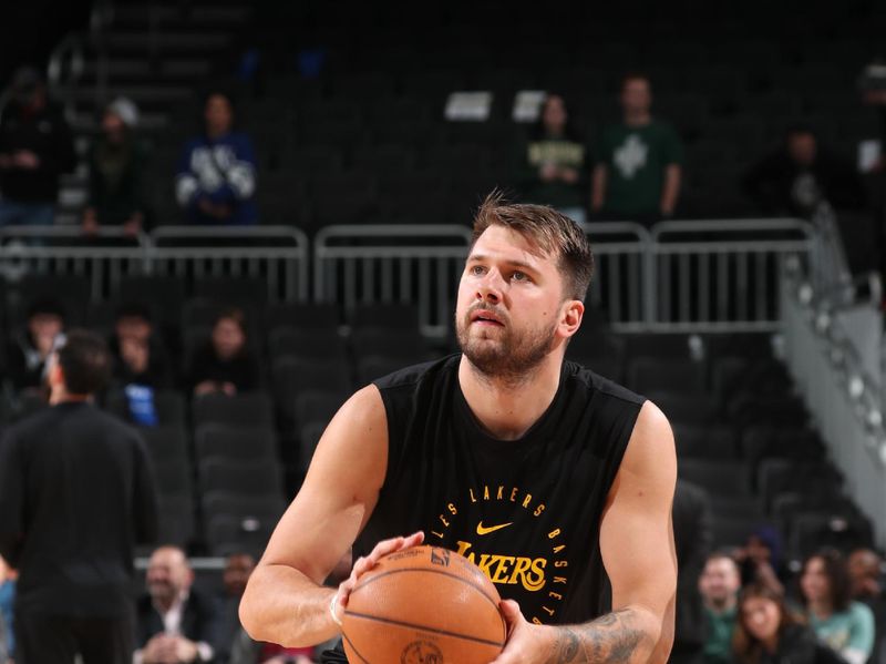 MILWAUKEE, WI - MARCH 13: Luka Doncic #77 of the Los Angeles Lakers warms up before the game against the Milwaukee Bucks on March 13, 2025 at Fiserv Forum Center in Milwaukee, Wisconsin. NOTE TO USER: User expressly acknowledges and agrees that, by downloading and or using this Photograph, user is consenting to the terms and conditions of the Getty Images License Agreement. Mandatory Copyright Notice: Copyright 2025 NBAE(Photo by Gary Dineen/NBAE via Getty Images).