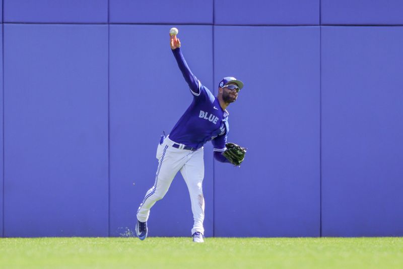 Feb 28, 2023; Dunedin, Florida, USA; Toronto Blue Jays center fielder Kevin Kiermaier (39) throws to the infield during the third inning against the Detroit Tigers at TD Ballpark. Mandatory Credit: Mike Watters-USA TODAY Sports