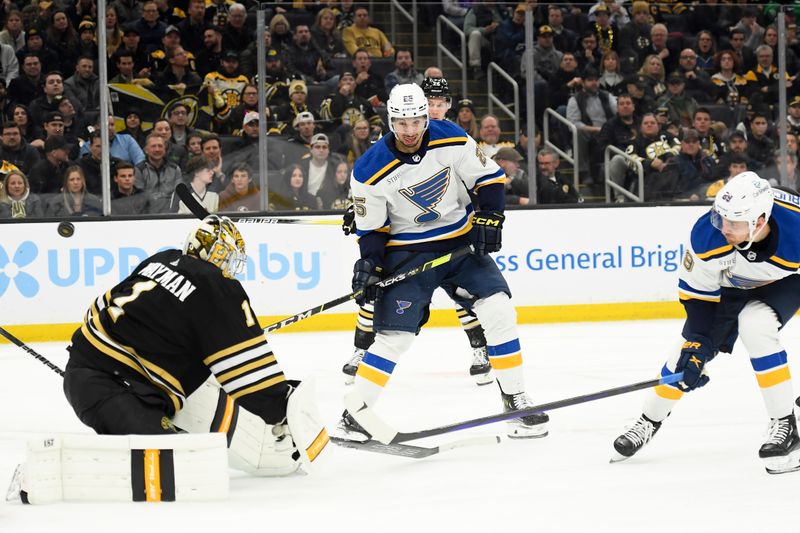 Mar 11, 2024; Boston, Massachusetts, USA;  Boston Bruins goaltender Jeremy Swayman (1) tries to poke away from St. Louis Blues left wing Pavel Buchnevich (89) during the second period at TD Garden. Mandatory Credit: Bob DeChiara-USA TODAY Sports