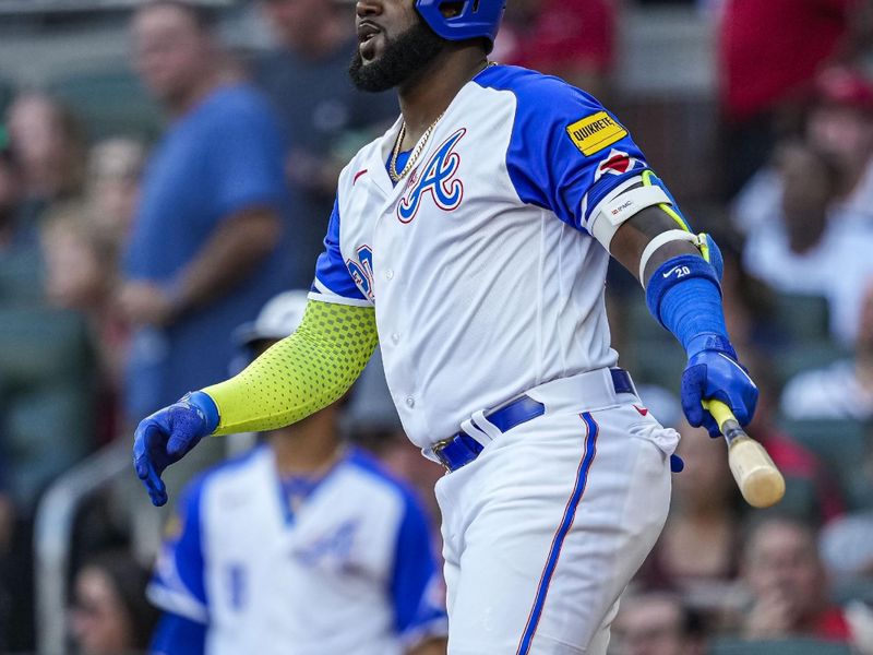 Jul 29, 2023; Cumberland, Georgia, USA; Atlanta Braves designated hitter Marcell Ozuna (20) watches after hitting a fly ball off the outfield wall against the Milwaukee Brewers during the first inning at Truist Park. Mandatory Credit: Dale Zanine-USA TODAY Sports