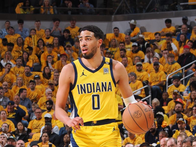 INDIANAPOLIS, IN - APRIL 26:  Tyrese Haliburton #0 of the Indiana Pacers handles the ball during the game again the Milwaukee Bucks during Round 1 Game 3 of the 2024 NBA Playoffs on April 26, 2024 at Gainbridge Fieldhouse in Indianapolis, Indiana. NOTE TO USER: User expressly acknowledges and agrees that, by downloading and or using this Photograph, user is consenting to the terms and conditions of the Getty Images License Agreement. Mandatory Copyright Notice: Copyright 2024 NBAE (Photo by Ron Hoskins/NBAE via Getty Images)