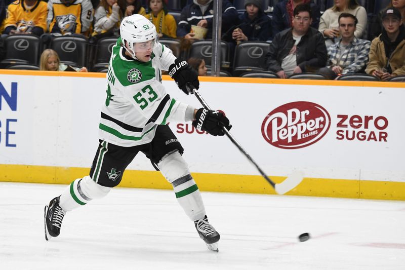 Dec 23, 2023; Nashville, Tennessee, USA; Dallas Stars center Wyatt Johnston (53) shoots the puck during the second period against the Nashville Predators at Bridgestone Arena. Mandatory Credit: Christopher Hanewinckel-USA TODAY Sports