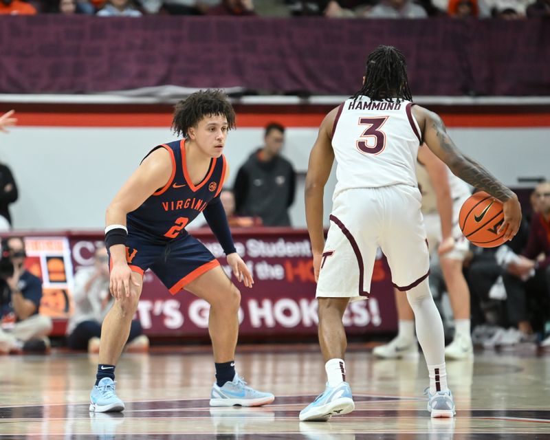 Dec 31, 2025; Blacksburg, Virginia, USA;  Virginia Cavaliers guard Chance Mallory (2) defends .Virginia Tech Hokies guard Ben Hammond (3) during the first overtime period at Cassell Coliseum. Mandatory Credit: Brian Bishop-Imagn Images