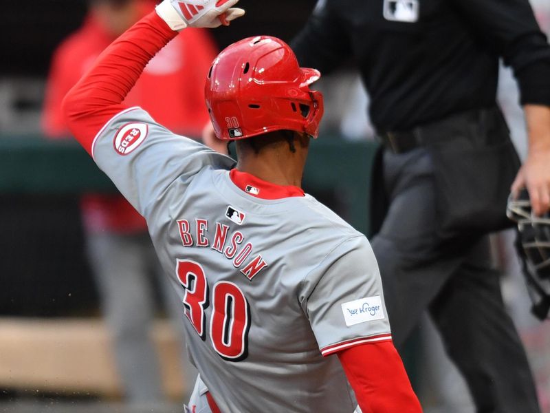 Apr 12, 2024; Chicago, Illinois, USA; Cincinnati Reds center fielder Will Benson (30) slides into home plate to score off a sacrifice fly against the Chicago White Sox during the first inning at Guaranteed Rate Field. Mandatory Credit: Patrick Gorski-USA TODAY Sports