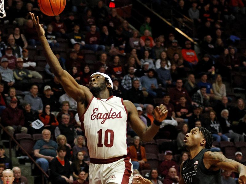 Jan 23, 2024; Blacksburg, Virginia, USA; Boston College Eagles guard Prince Aligbe (10) reaches for a pass against Virginia Tech Hokies guard MJ Collins (2) during the first half at Cassell Coliseum. Mandatory Credit: Peter Casey-USA TODAY Sports