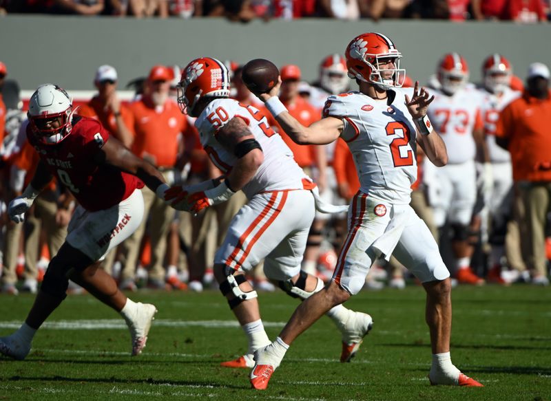 Oct 28, 2023; Raleigh, North Carolina, USA; Clemson Tigers cornerback Nate Wiggins (2) throws a pass during the first half against the North Carolina State Wolfpack at Carter-Finley Stadium. Mandatory Credit: Rob Kinnan-USA TODAY Sports