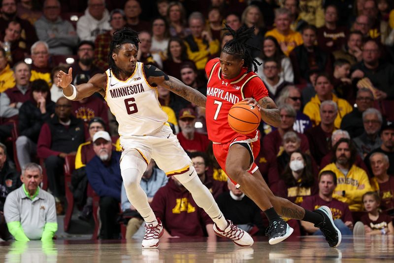 Feb 8, 2026; Minneapolis, Minnesota, USA; Maryland Terrapins guard Andre Mills (7) works around Minnesota Golden Gophers guard Langston Reynolds (6) during the first half at Williams Arena. Mandatory Credit: Matt Krohn-Imagn Images