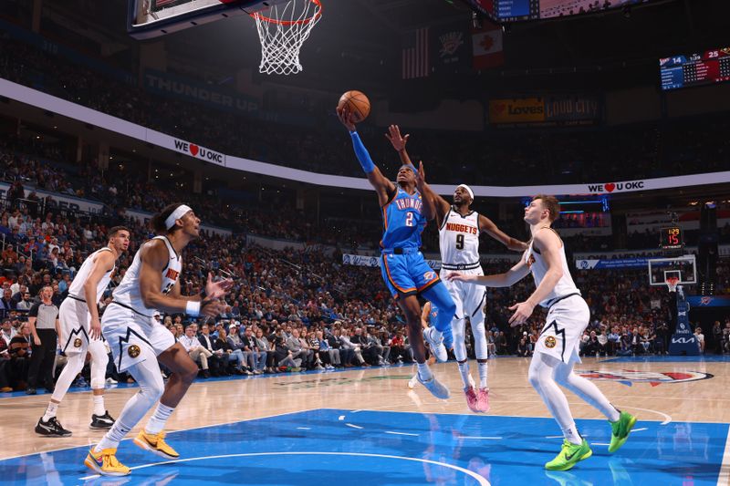 OKLAHOMA CITY, OK - JANUARY 31: Shai Gilgeous-Alexander #2 of the Oklahoma City Thunder drives to the basket during the game against the Denver Nuggets on January 31, 2024 at Paycom Arena in Oklahoma City, Oklahoma. NOTE TO USER: User expressly acknowledges and agrees that, by downloading and or using this photograph, User is consenting to the terms and conditions of the Getty Images License Agreement. Mandatory Copyright Notice: Copyright 2024 NBAE (Photo by Zach Beeker/NBAE via Getty Images)