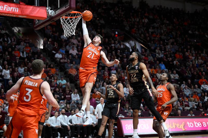 Mar 4, 2023; Blacksburg, Virginia, USA;  Virginia Tech Hokies forward Grant Basile (21) shoots the ball against Florida State Seminoles guard Darin Green Jr. (22) and  guard Matthew Cleveland (35) at Cassell Coliseum. Mandatory Credit: Lee Luther Jr.-USA TODAY Sports