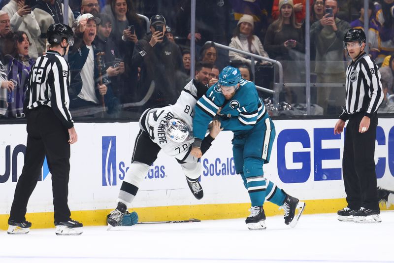 Dec 27, 2023; Los Angeles, California, USA; San Jose Sharks center Luke Kunin (11) and Los Angeles Kings right wing Alex Laferriere (78) fight during the third period of a game at Crypto.com Arena. Mandatory Credit: Jessica Alcheh-USA TODAY Sports