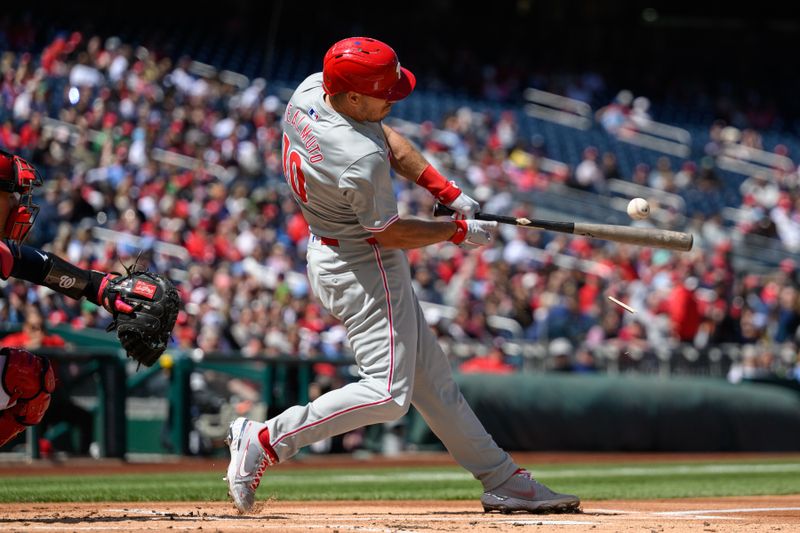 Apr 7, 2024; Washington, District of Columbia, USA; Philadelphia Phillies catcher J.T. Realmuto (10) at bat during the first inning against the Washington Nationals at Nationals Park. Mandatory Credit: Reggie Hildred-USA TODAY Sports