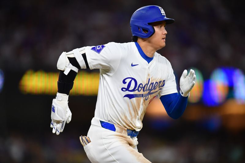 Aug 19, 2024; Los Angeles, California, USA; Los Angeles Dodgers designated hitter Shohei Ohtani (17) runs out a ground ball against the Seattle Mariners during the sixth inning at Dodger Stadium. Mandatory Credit: Gary A. Vasquez-USA TODAY Sports