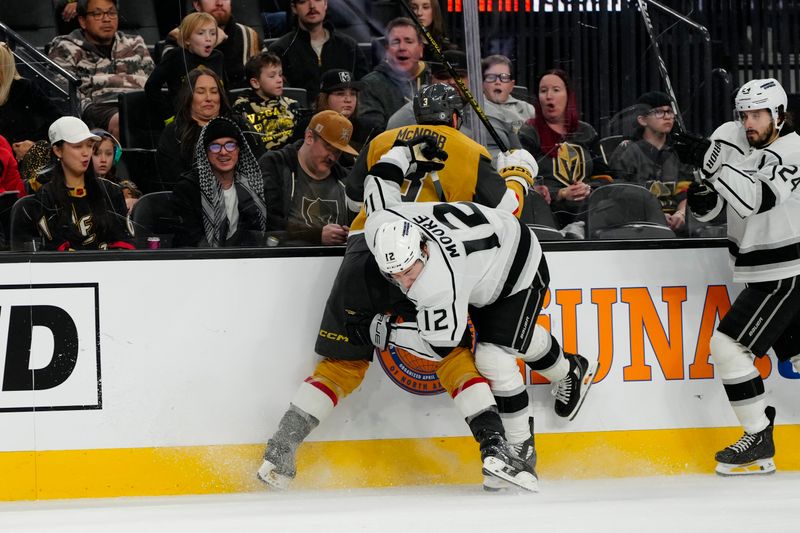 Dec 28, 2023; Las Vegas, Nevada, USA; Vegas Golden Knights defenseman Brayden McNabb (3) checks Los Angeles Kings left wing Trevor Moore (12) during the third period at T-Mobile Arena. Mandatory Credit: Lucas Peltier-USA TODAY Sports