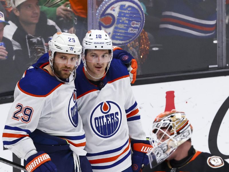 Feb 9, 2024; Anaheim, California, USA; Edmonton Oilers center Leon Draisaitl (29) and left wing Zach Hyman (18) celebrate after Draisaitl scores a goal against the Anaheim Ducks during the third period of a game at Honda Center. Mandatory Credit: Jessica Alcheh-USA TODAY Sports