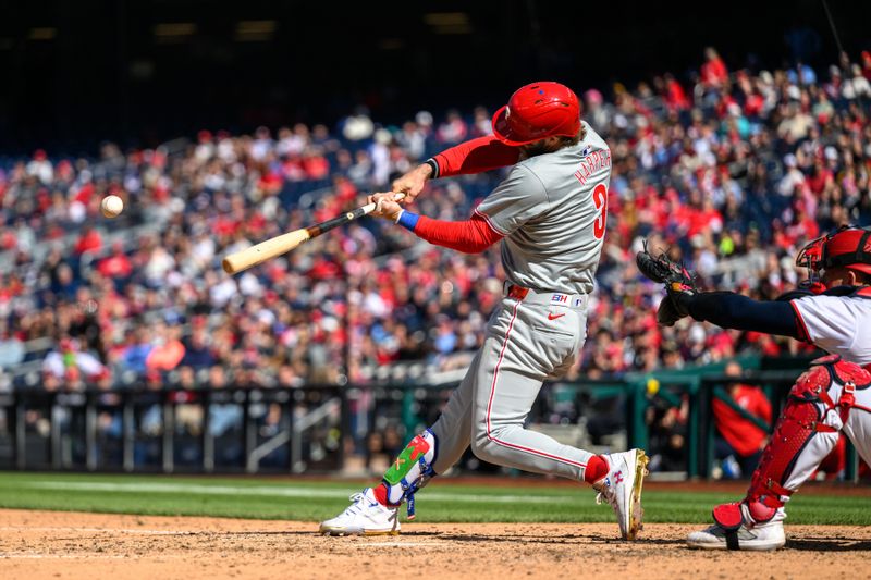 Apr 7, 2024; Washington, District of Columbia, USA; Philadelphia Phillies first base Bryce Harper (3) hits a single during the first inning against the Washington Nationals at Nationals Park. Mandatory Credit: Reggie Hildred-USA TODAY Sports