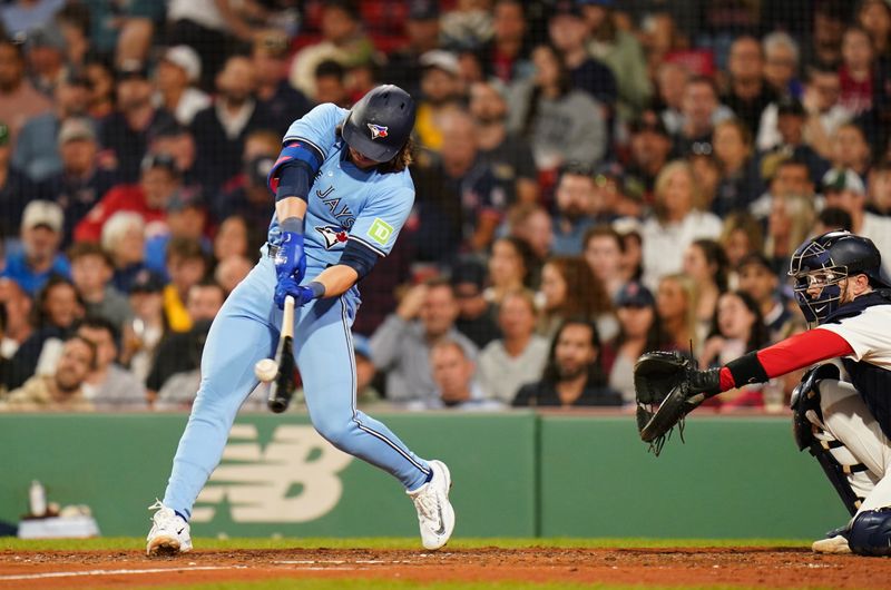 Aug 29, 2024; Boston, Massachusetts, USA; Toronto Blue Jays third baseman Addison Barger (47) his a double against them Boston Red Sox in the sixth inning at Fenway Park. Mandatory Credit: David Butler II-USA TODAY Sports