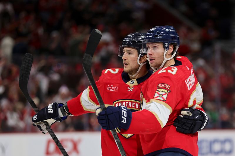 Jan 15, 2024; Sunrise, Florida, USA; Florida Panthers center Carter Verhaeghe (23) celebrates with center Sam Reinhart (13) after scoring against the Anaheim Ducks during the second period at Amerant Bank Arena. Mandatory Credit: Sam Navarro-USA TODAY Sports