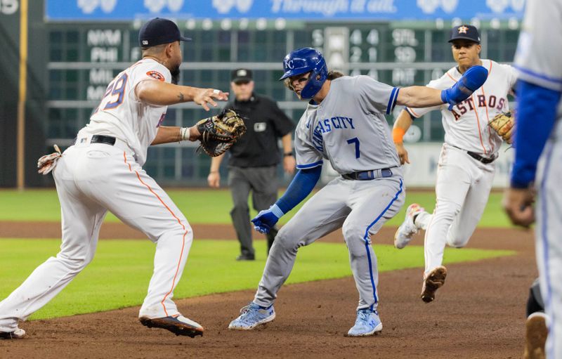 Sep 23, 2023; Houston, Texas, USA; Kansas City Royals shortstop Bobby Witt Jr. (7) is tagged out by Houston Astros first baseman Jose Abreu (79) in a rundown in the fifth inning at Minute Maid Park. Mandatory Credit: Thomas Shea-USA TODAY Sports