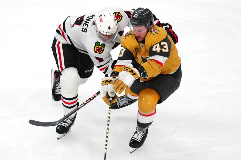 Apr 16, 2024; Las Vegas, Nevada, USA; Chicago Blackhawks defenseman Seth Jones (4) attempts to check Vegas Golden Knights center Paul Cotter (43) during the second period at T-Mobile Arena. Mandatory Credit: Stephen R. Sylvanie-USA TODAY Sports