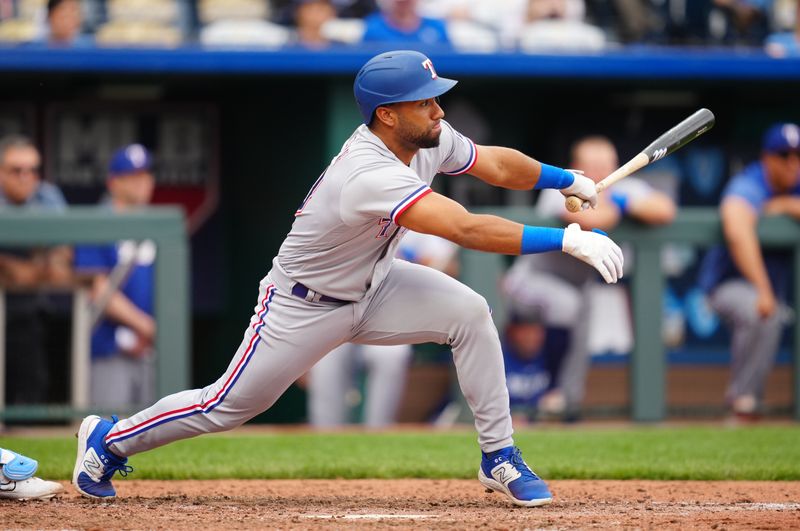 Apr 19, 2023; Kansas City, Missouri, USA; Texas Rangers third baseman Ezequiel Duran (20) hits a three-run RBI during the seventh inning against the Kansas City Royals at Kauffman Stadium. Mandatory Credit: Jay Biggerstaff-USA TODAY Sports