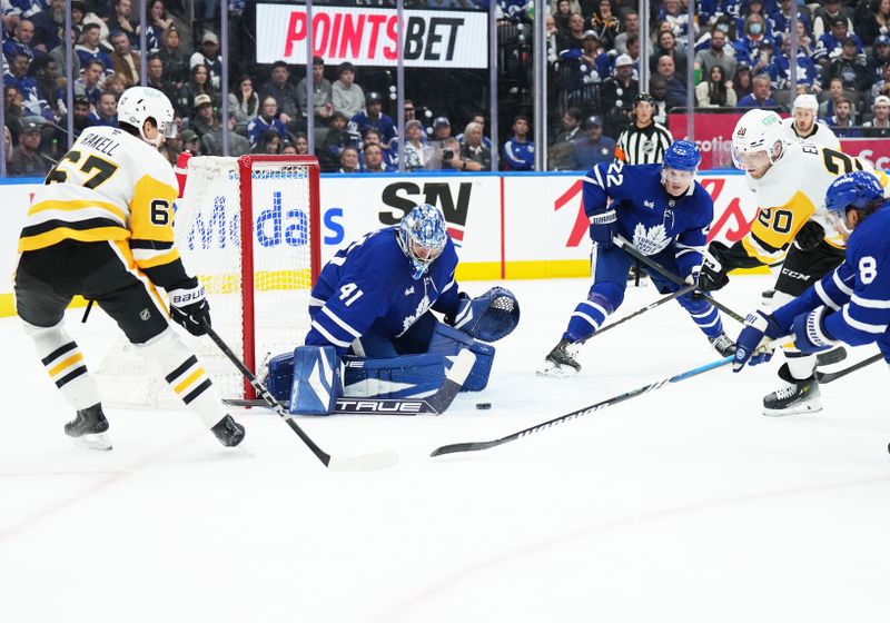 Oct 12, 2024; Toronto, Ontario, CAN; Pittsburgh Penguins center Lars Eller (20) battles for the puck in front of Toronto Maple Leafs goaltender Anthony Stolarz (41) during the second period at Scotiabank Arena. Mandatory Credit: Nick Turchiaro-Imagn Images