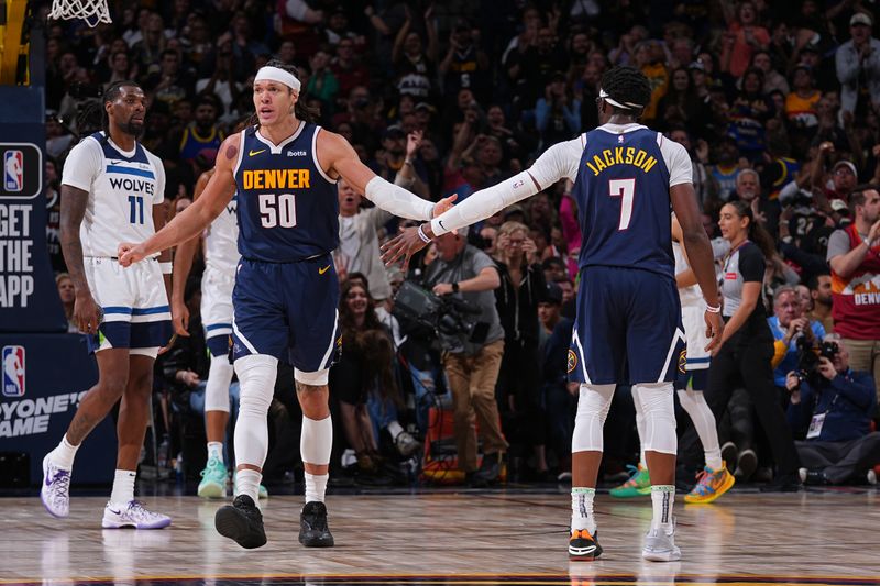 DENVER, CO - APRIL 10: Aaron Gordon #50 of the Denver Nuggets high fives Reggie Jackson #7 during the game against the Minnesota Timberwolves on April 10, 2024 at the Ball Arena in Denver, Colorado. NOTE TO USER: User expressly acknowledges and agrees that, by downloading and/or using this Photograph, user is consenting to the terms and conditions of the Getty Images License Agreement. Mandatory Copyright Notice: Copyright 2024 NBAE (Photo by Bart Young/NBAE via Getty Images)