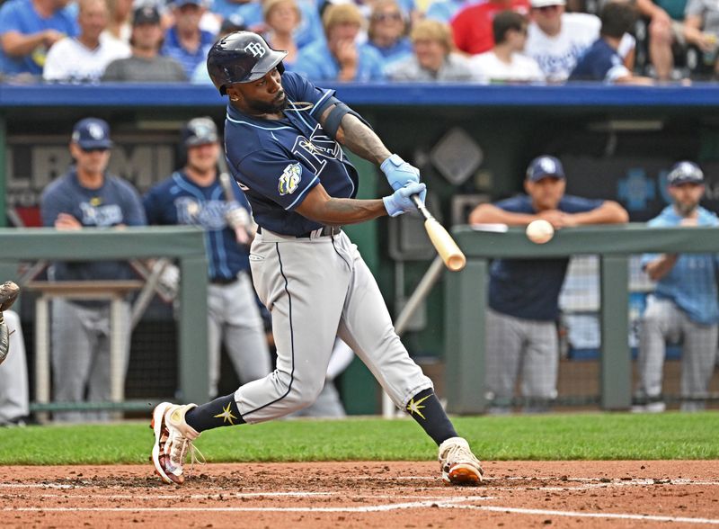 Jul 15, 2023; Kansas City, Missouri, USA;  Tampa Bay Rays left fielder Randy Arozarena (56) hits an RBI single in the third inning against the Kansas City Royals at Kauffman Stadium. Mandatory Credit: Peter Aiken-USA TODAY Sports