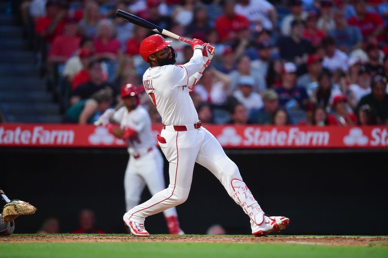May 10, 2025; Anaheim, California, USA; Los Angeles Angels right fielder Jo Adell (7) hits a solo home run against the Baltimore Orioles during the fourth inning at Angel Stadium. Mandatory Credit: Gary A. Vasquez-Imagn Images
