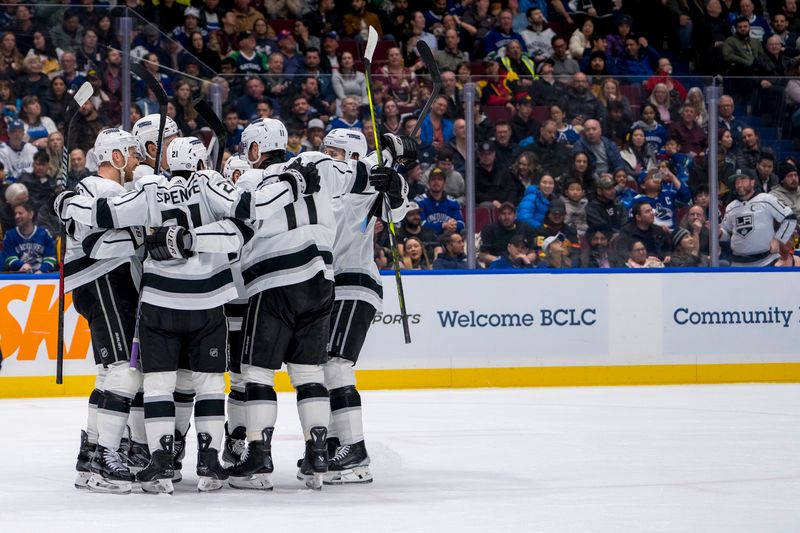 Mar 25, 2024; Vancouver, British Columbia, CAN; Los Angeles Kings defenseman Jordan Spence (21), forward Anze Kopitar (11), defenseman Andreas Englund (5) and forward Blake Lizotte (46) celebrate Lizotte’s goal against the Vancouver Canucks in the second period at Rogers Arena. Mandatory Credit: Bob Frid-USA TODAY Sports