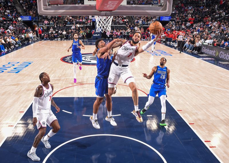 INGLEWOOD, CA - OCTOBER 14: Amir Coffey #7 of the LA Clippers drives to the basket during the game against the Dallas Mavericks on October 14, 2024 at Intuit Dome in Los Angeles, California. NOTE TO USER: User expressly acknowledges and agrees that, by downloading and/or using this Photograph, user is consenting to the terms and conditions of the Getty Images License Agreement. Mandatory Copyright Notice: Copyright 2024 NBAE (Photo by Juan Ocampo/NBAE via Getty Images)