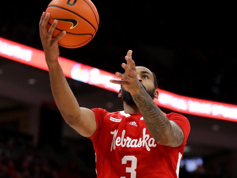 Feb 29, 2024; Columbus, Ohio, USA;  Nebraska Cornhuskers guard Brice Williams (3) shoots as Ohio State Buckeyes guard Evan Mahaffey (12) defends during the first half at Value City Arena. Mandatory Credit: Joseph Maiorana-USA TODAY Sports