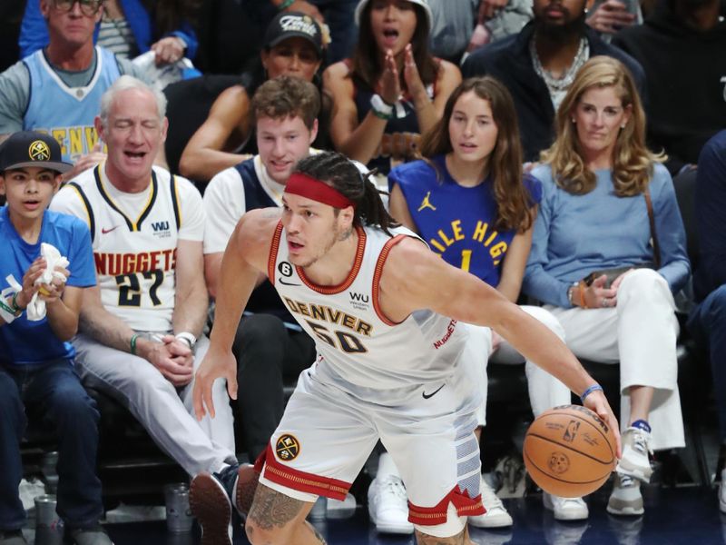 DENVER, CO - JUNE 12: Aaron Gordon #50 of the Denver Nuggets dribbles the ball during game 5 of the 2023 NBA Finals against the Miami Heat on June 12, 2023 at the Ball Arena in Denver, Colorado. NOTE TO USER: User expressly acknowledges and agrees that, by downloading and/or using this Photograph, user is consenting to the terms and conditions of the Getty Images License Agreement. Mandatory Copyright Notice: Copyright 2023 NBAE (Photo by Issac Baldizon/NBAE via Getty Images)