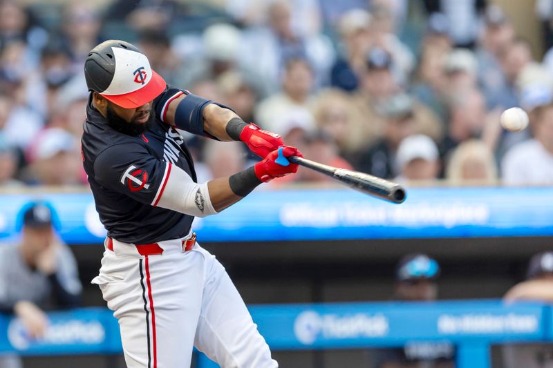 May 14, 2024; Minneapolis, Minnesota, USA; Minnesota Twins right fielder Manuel Margot (13) hits a single against the New York Yankees in the first inning at Target Field. Mandatory Credit: Jesse Johnson-USA TODAY Sports