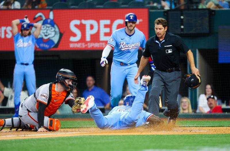 Jun 9, 2024; Arlington, Texas, USA; Texas Rangers right fielder Adolis García (53) steals home ahead of the tag by San Francisco Giants catcher Patrick Bailey (14) during the first inning at Globe Life Field. Mandatory Credit: Kevin Jairaj-USA TODAY Sports