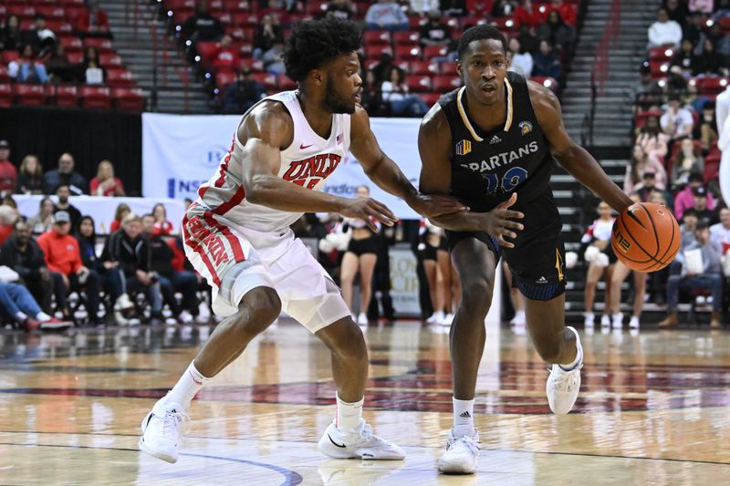 Feb 14, 2023; Las Vegas, Nevada, USA; UNLV Runnin' Rebels guard EJ Harkless (55) guards San Jose State Spartans guard Omari Moore (10) in the second half at Thomas & Mack Center. Mandatory Credit: Candice Ward-USA TODAY Sports