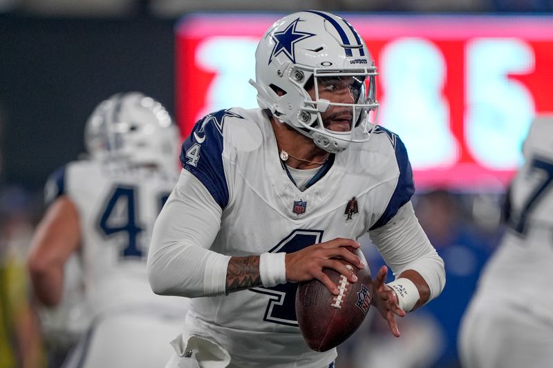 Dallas Cowboys quarterback Dak Prescott (4) looks to pass against the New York Giants during the first quarter of an NFL football game, Thursday, Sept. 26, 2024, in East Rutherford, N.J. (AP Photo/Bryan Woolston)