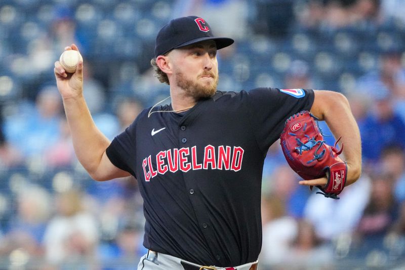 Sep 3, 2024; Kansas City, Missouri, USA; Cleveland Guardians starting pitcher Tanner Bibee (28) delivers a pitch against the Kansas City Royals in the first inning at Kauffman Stadium. Mandatory Credit: Denny Medley-Imagn Images