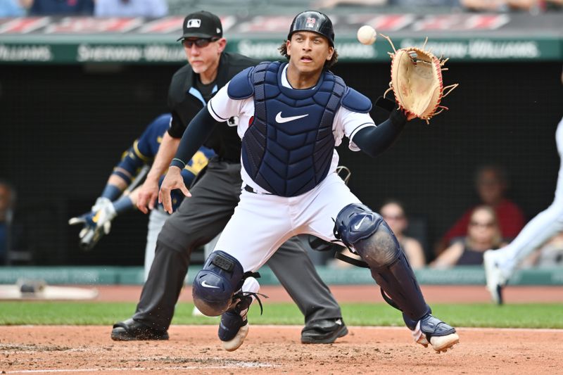 Jun 25, 2023; Cleveland, Ohio, USA; Cleveland Guardians catcher Bo Naylor (23) catches a throw from left fielder Steven Kwan (not pictured) but its too late to tag Milwaukee Brewers second baseman Andruw Monasterio (not pictured) during the fourth inning at Progressive Field. Mandatory Credit: Ken Blaze-USA TODAY Sports