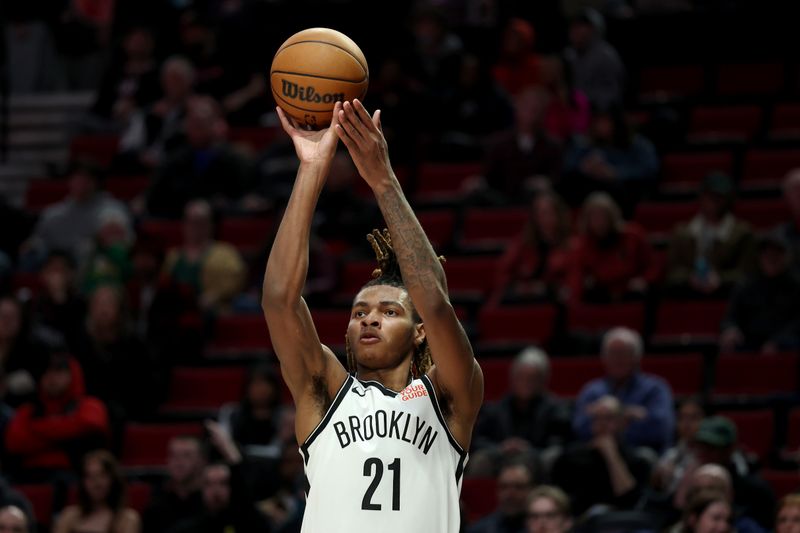 PORTLAND, OREGON - JANUARY 14: Noah Clowney #21 of the Brooklyn Nets shoots against the Portland Trail Blazers during the second half at Moda Center on January 14, 2025 in Portland, Oregon. NOTE TO USER: User expressly acknowledges and agrees that, by downloading and or using this photograph, User is consenting to the terms and conditions of the Getty Images License Agreement. (Photo by Steph Chambers/Getty Images)