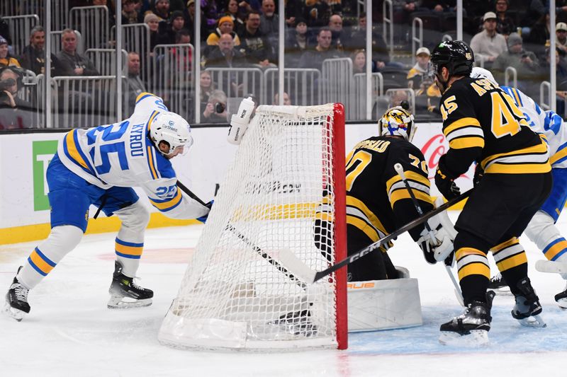 Dec 4, 2025; Boston, Massachusetts, USA; St. Louis Blues right wing Jordan Kyrou (25) tries to stuff the puck past Boston Bruins goaltender Joonas Korpisalo (70) during the second period at TD Garden. Mandatory Credit: Bob DeChiara-Imagn Images