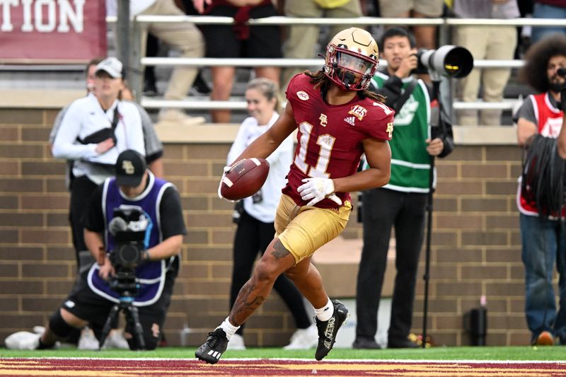 Sep 30, 2023; Chestnut Hill, Massachusetts, USA; Boston College Eagles wide receiver Lewis Bond (11) scores a touchdown against the Virginia Cavaliers during the second half at Alumni Stadium. Mandatory Credit: Brian Fluharty-USA TODAY Sports