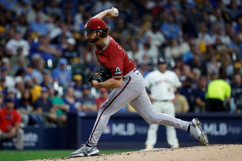 Oct 4, 2023; Milwaukee, Wisconsin, USA; Arizona Diamondbacks starting pitcher Zac Gallen (23) pitches in the third inning against the Milwaukee Brewers during game two of the Wildcard series for the 2023 MLB playoffs at American Family Field. Mandatory Credit: Kamil Krzaczynski-USA TODAY Sports